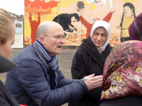 Tour Guide, Mr Noel Large talks to participants about his experiences during the 'Troubles'.